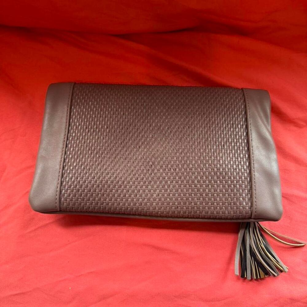 Kaari Blue Brown w/ like a weaving pattern on outside & blue&white lined stripes